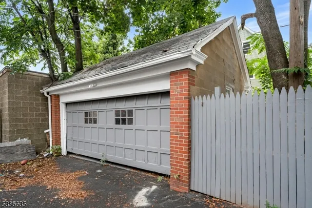 a view of wooden house and a yard