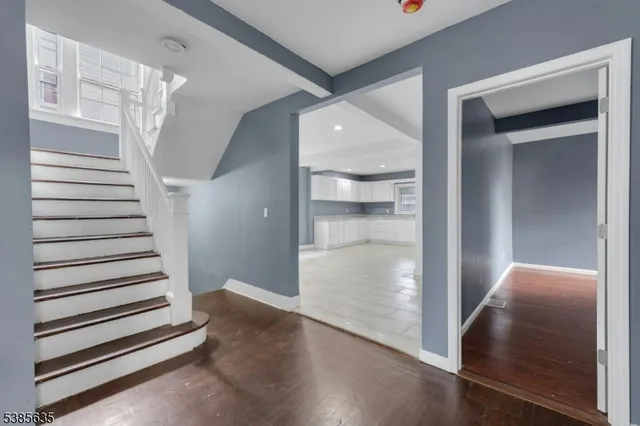a view of a hallway with staircase