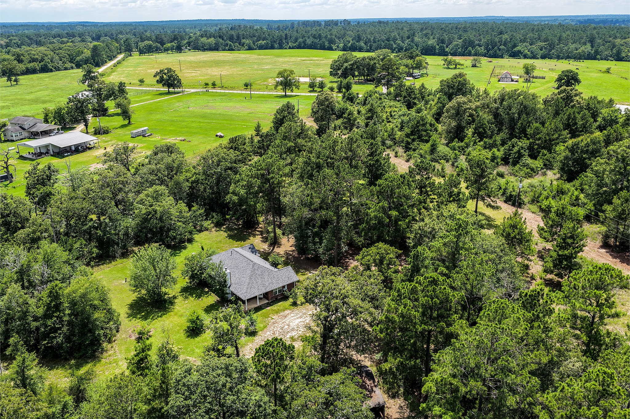 691 Bishop Road Huntsville, TX 77320 - Photo 25 of 32 an aerial view of a houses with outdoor space and swimming pool