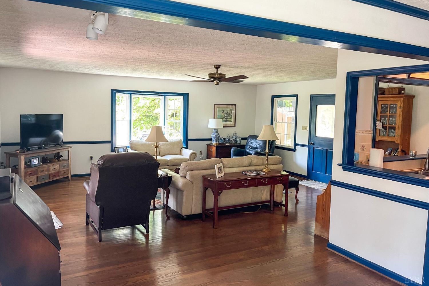 707 Fairgrounds Road Farmville, VA 23901 - Photo 7 of 26 a living room with furniture fireplace and a large window