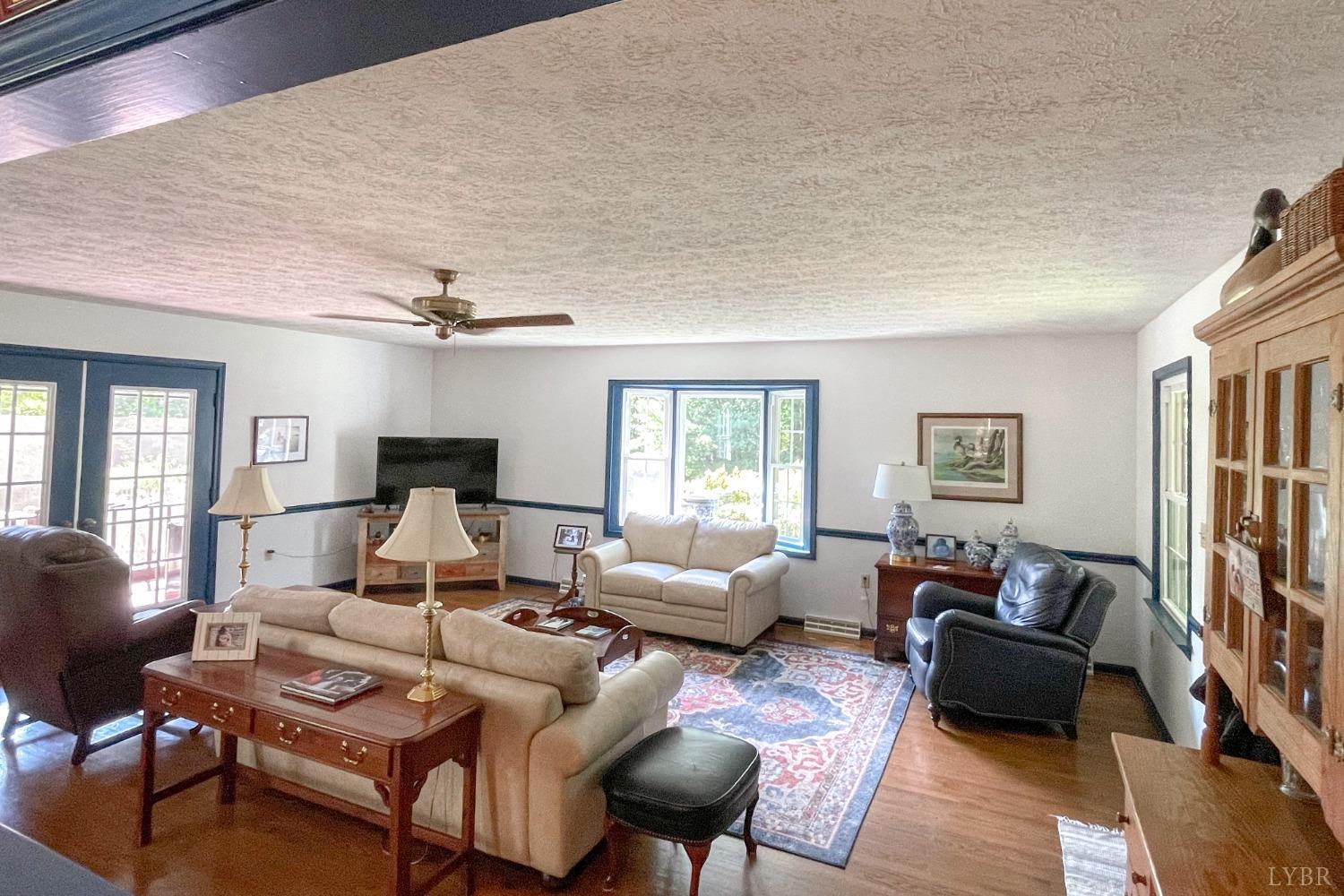 707 Fairgrounds Road Farmville, VA 23901 - Photo 8 of 26 a living room with furniture and a flat screen tv