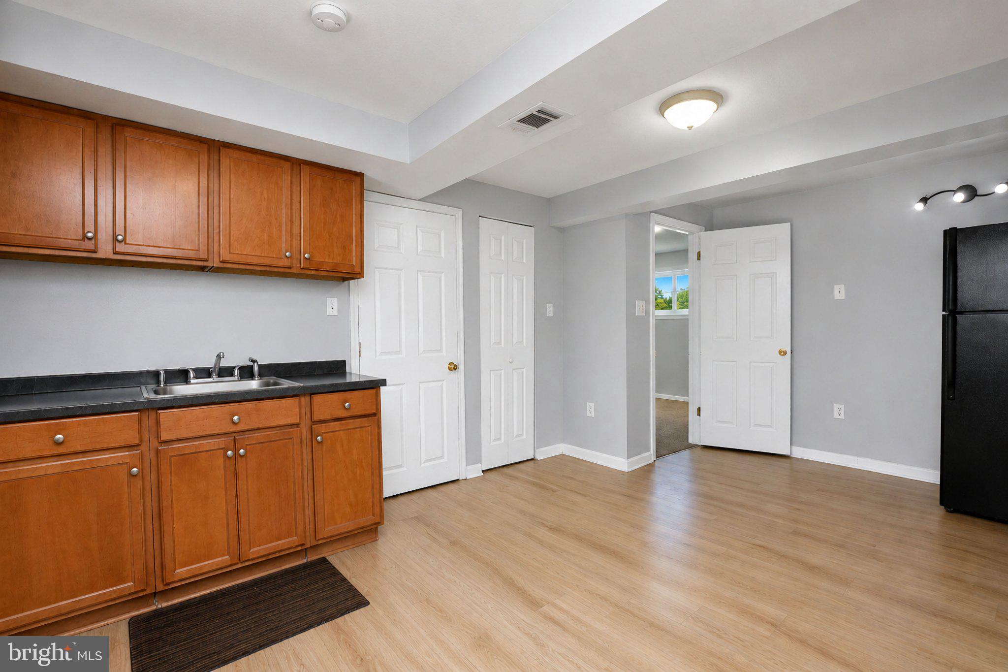 5712 Ash Drive Springfield, VA 22150 - Photo 25 of 38 Modern kitchen with warm wood accents.