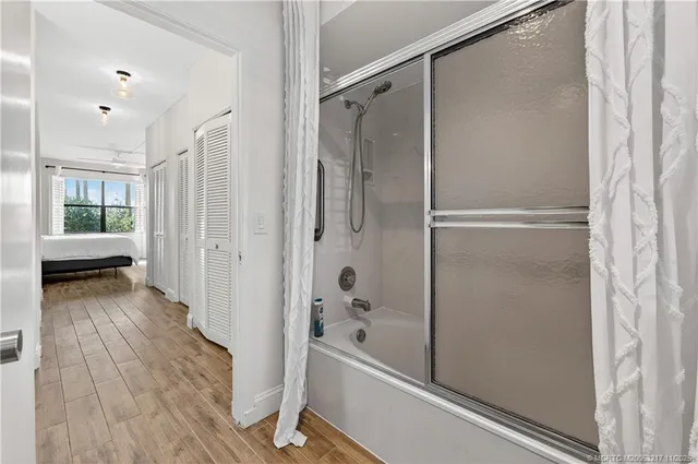 a bathroom with a bathtub and a shower