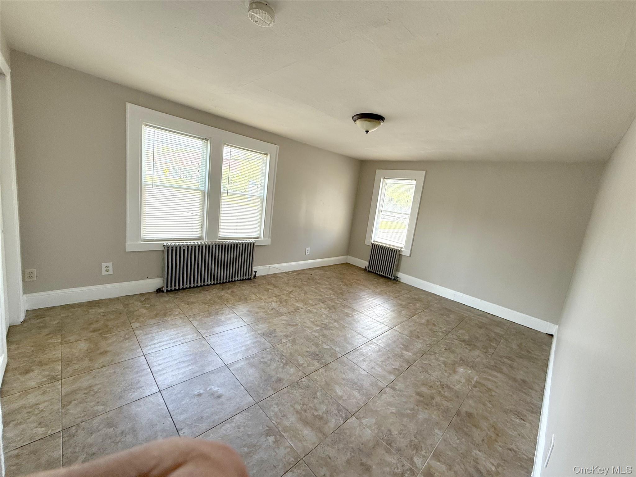 135 Ramapo Road Garnerville, NY 10923 - Photo 8 of 15 wooden floor in an empty room with a window