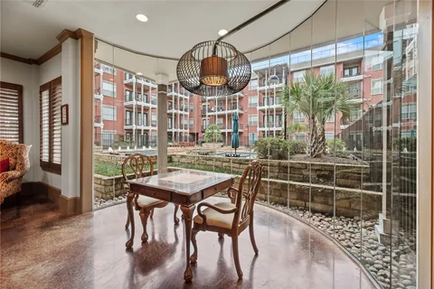 a room with furniture and pool table