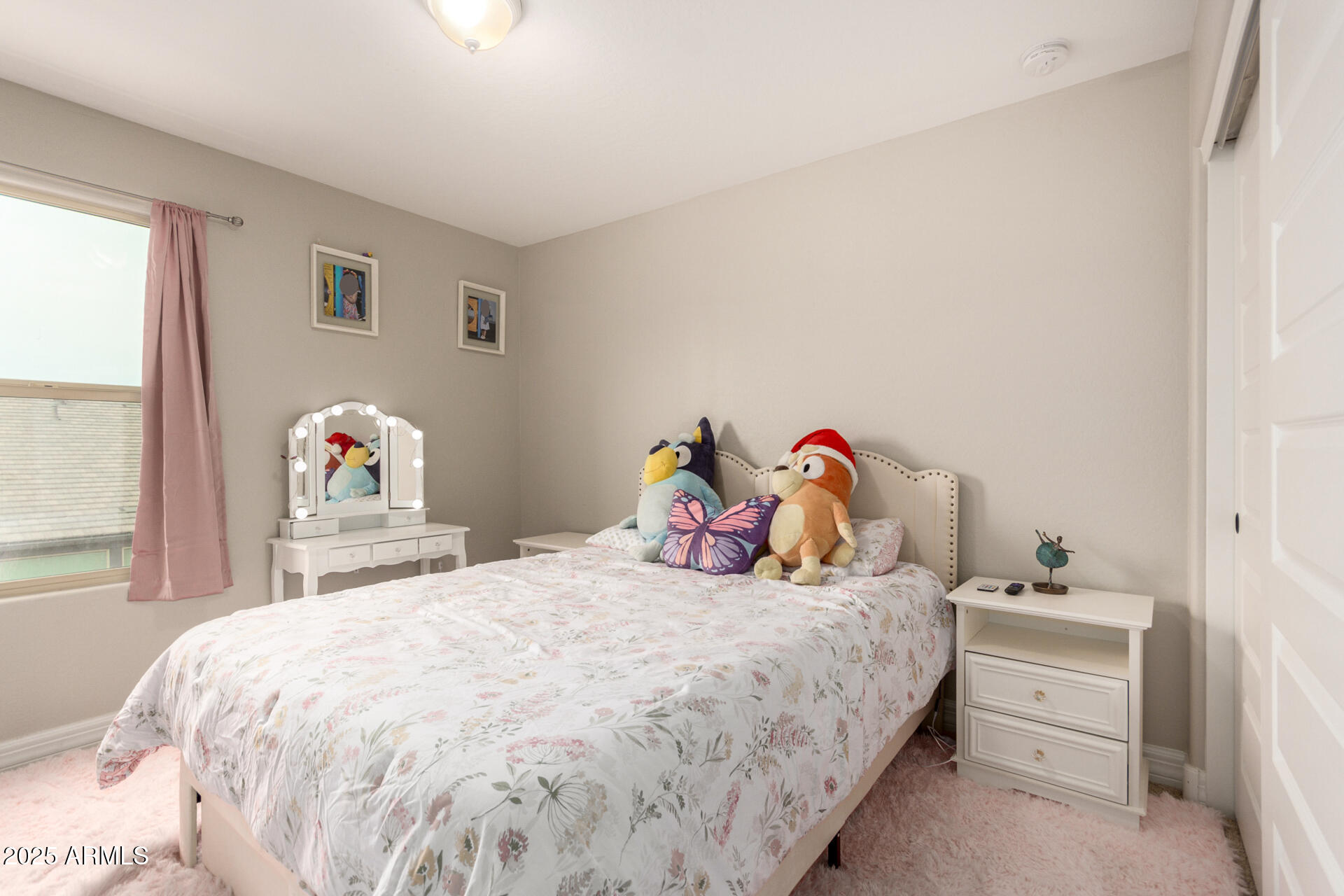 5126 West Roundhouse Road Laveen, AZ 85339 - Photo 27 of 39 a bedroom with a bed and a chandelier