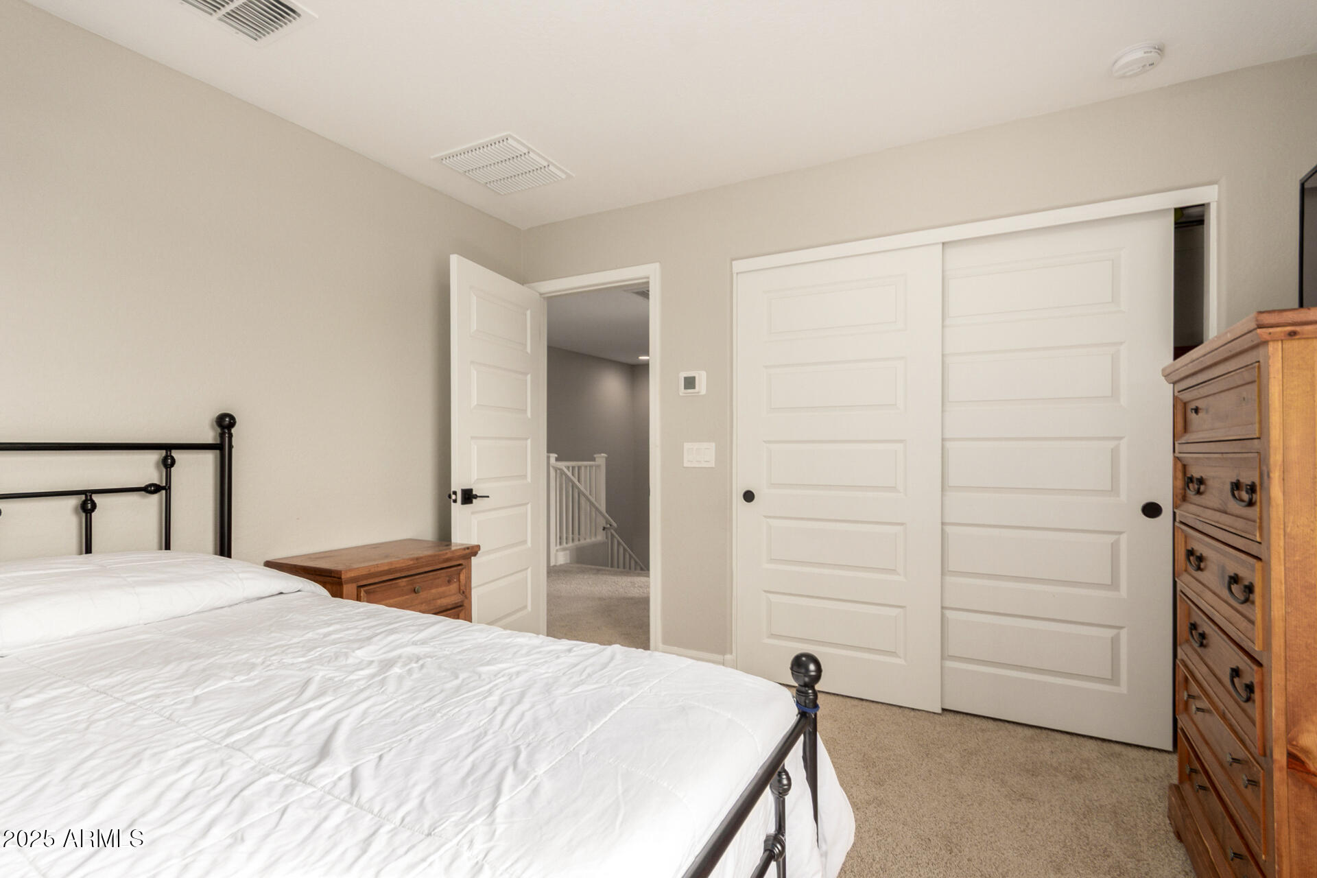 5126 West Roundhouse Road Laveen, AZ 85339 - Photo 30 of 39 a bedroom with a bed and a closet