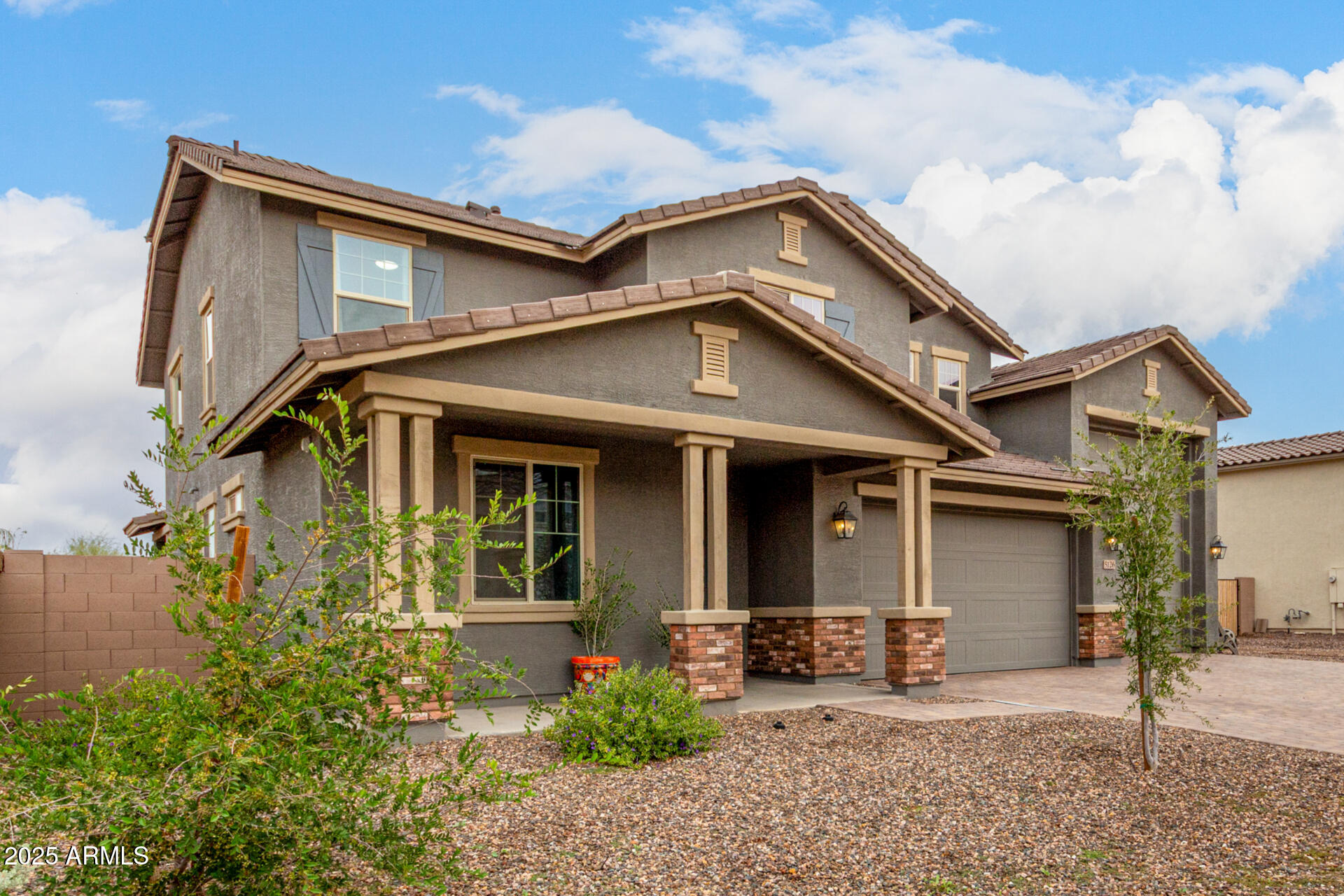 5126 West Roundhouse Road Laveen, AZ 85339 - Photo 3 of 39 front view of a house with a small yard