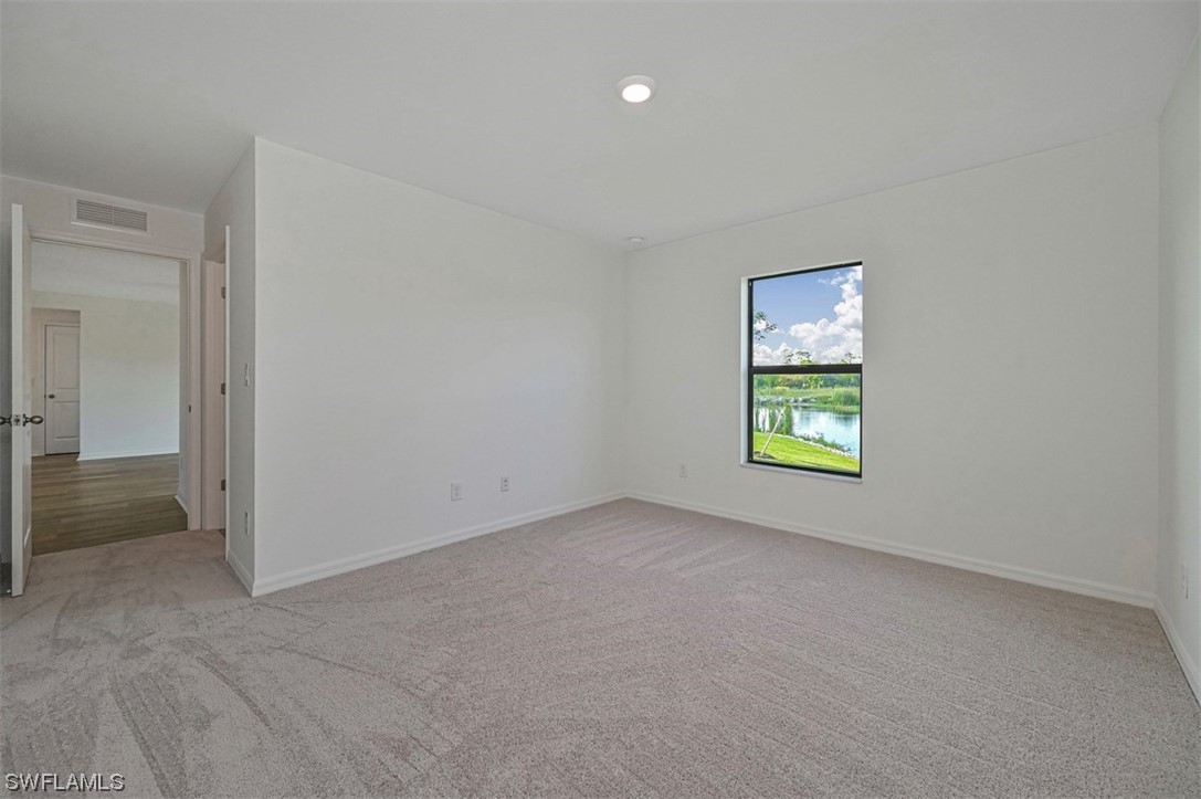 880 General Chesty Puller Court LaBelle, FL 33935 - Photo 13 of 21 an empty room with windows and closet
