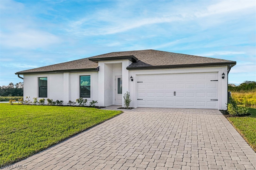 880 General Chesty Puller Court LaBelle, FL 33935 - Photo 2 of 21 a front view of house with yard