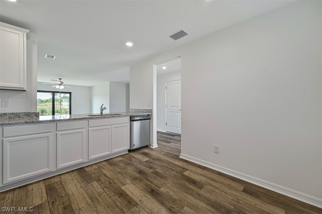 880 General Chesty Puller Court LaBelle, FL 33935 - Photo 10 of 21 a view of a kitchen with wooden floor