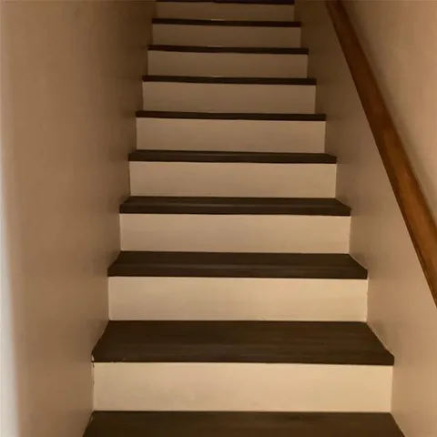 a view of a livingroom with workspace and a window