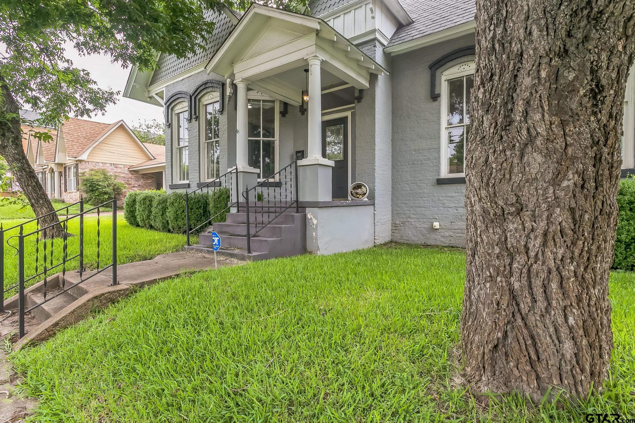 293 South Barron Rusk, TX 75785 - Photo 13 of 30 a view of a brick house with a yard and plants