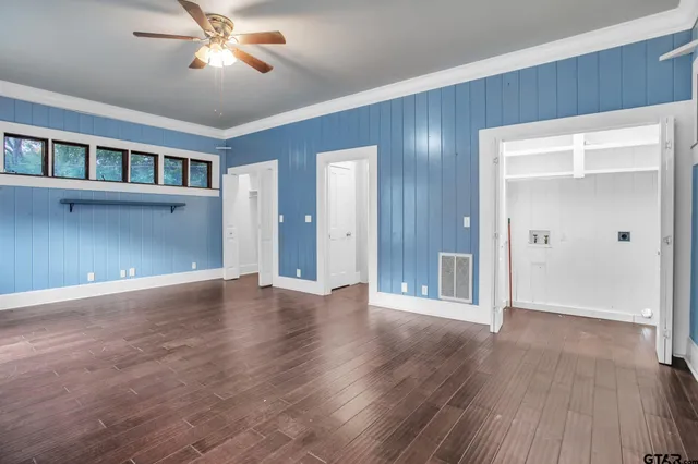 a view of a hallway with windows