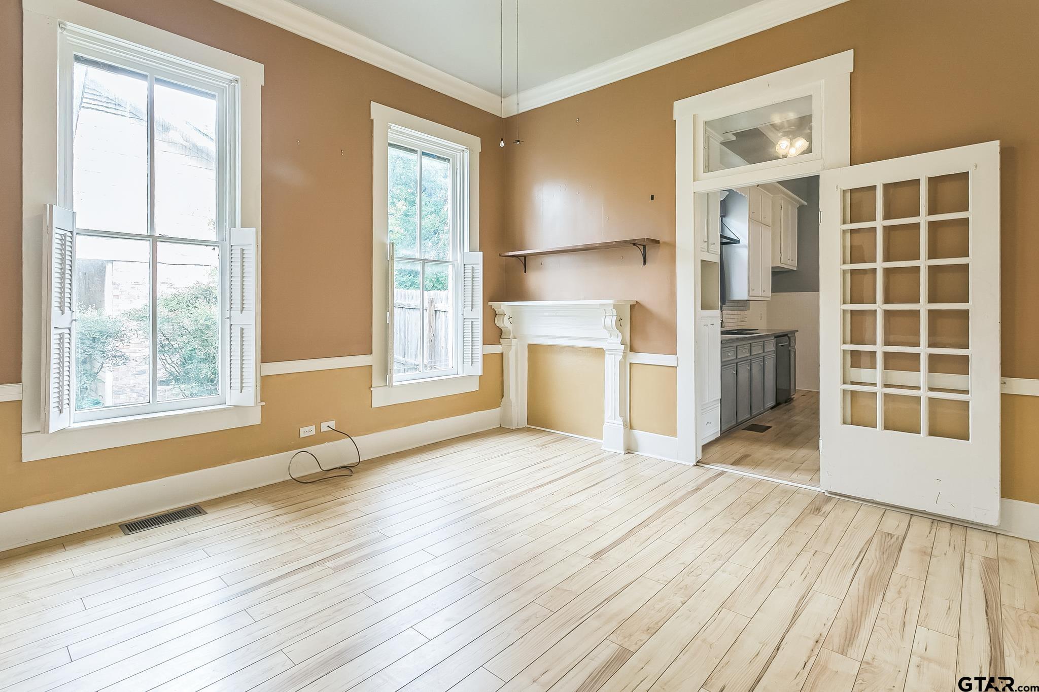 293 South Barron Rusk, TX 75785 - Photo 21 of 30 an empty room with wooden floor and windows