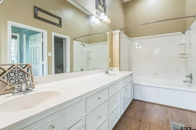 a bathroom with a bathtub and a sink