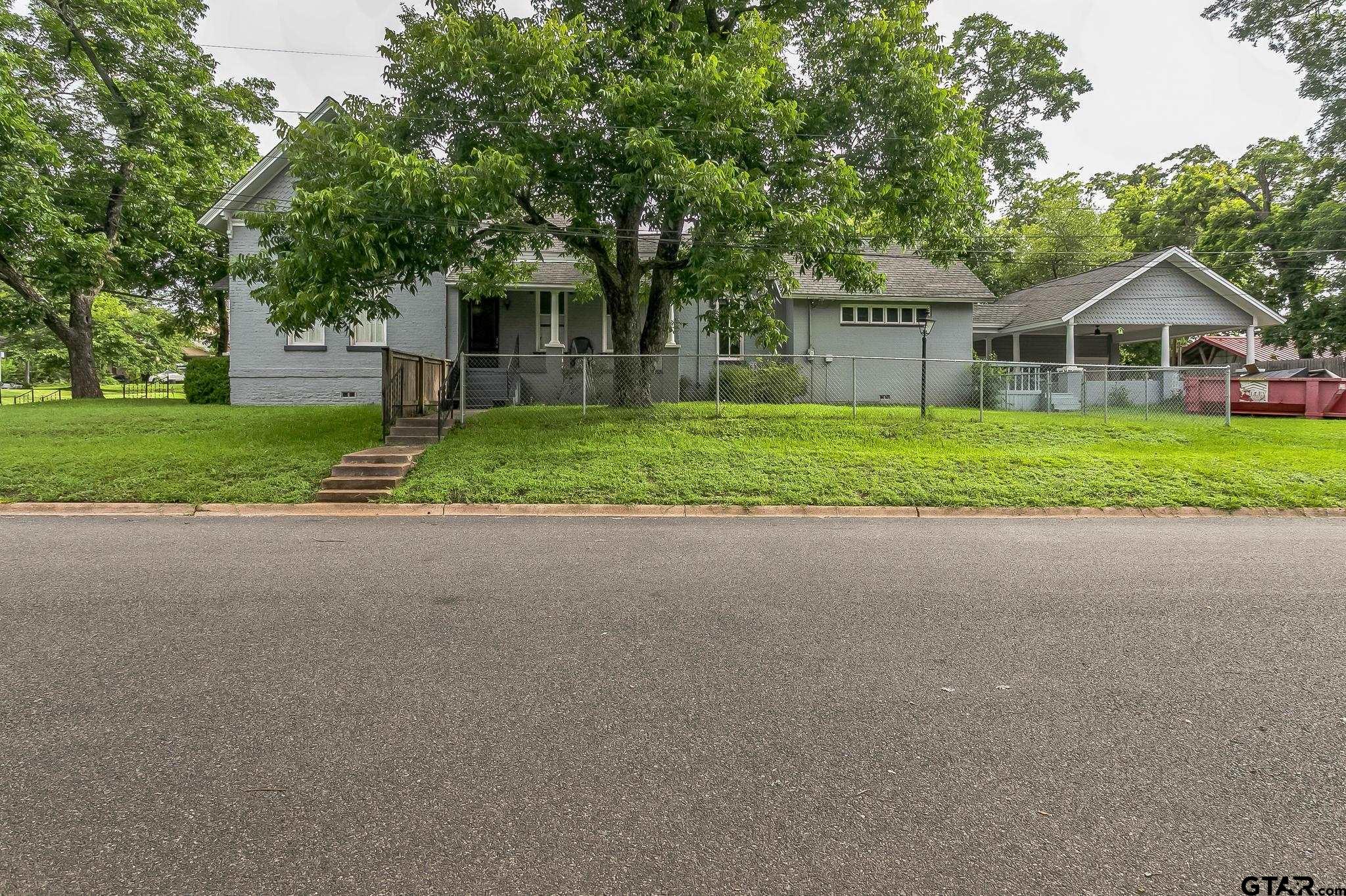 293 South Barron Rusk, TX 75785 - Photo 5 of 30 a front view of a house with a yard and trees