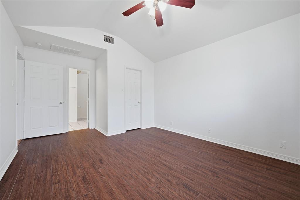 2418 Loy Lake Road Denison, TX 75020 - Photo 16 of 23 a view of an empty room with wooden floor