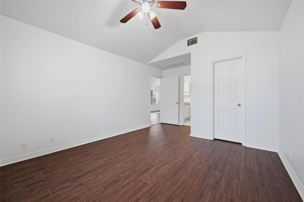 2418 Loy Lake Road Denison, TX 75020 - Photo 17 of 23 an empty room with wooden floor and windows