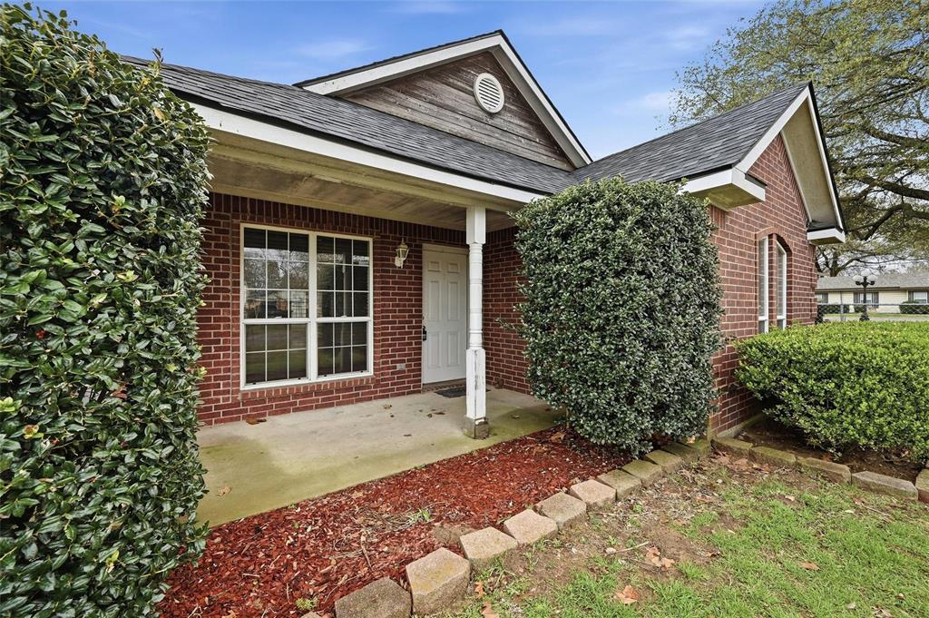 2418 Loy Lake Road Denison, TX 75020 - Photo 4 of 23 a front view of a house