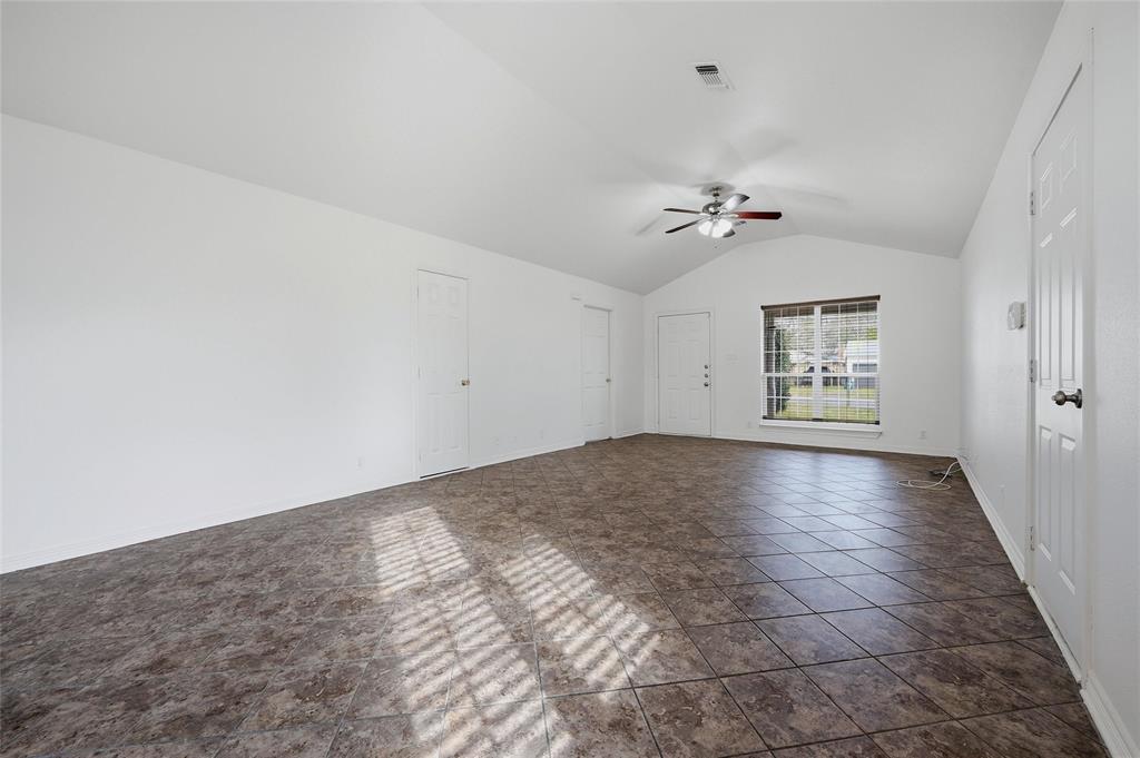 2418 Loy Lake Road Denison, TX 75020 - Photo 7 of 23 wooden floor in an empty room with a window