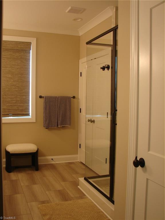 4034 Waterview Road High Point, NC 27265 - Photo 24 of 31 Primary bath shower, linen closet, water closet.