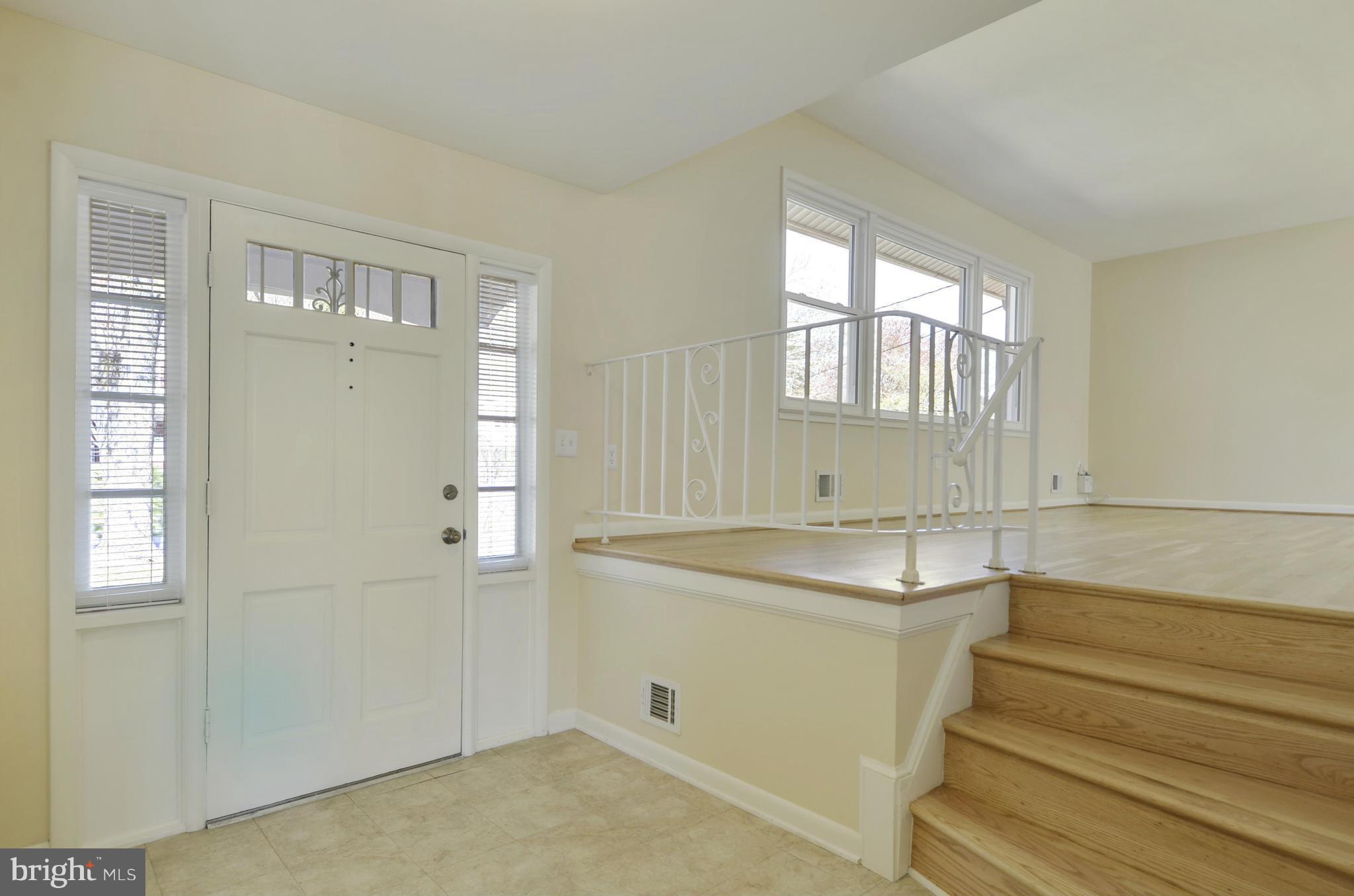 5404 Manorfield Road Rockville, MD 20853 - Photo 2 of 30 Generous, warm Foyer; guest closet to greet guests