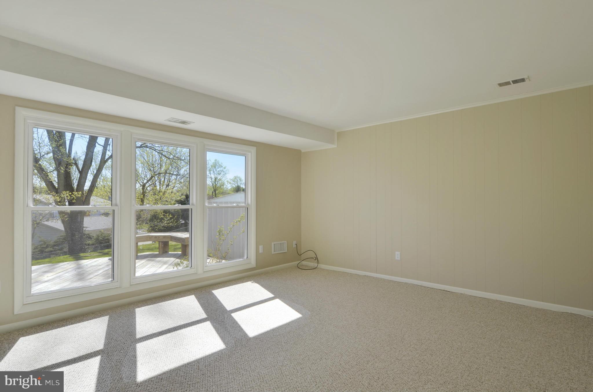 5404 Manorfield Road Rockville, MD 20853 - Photo 15 of 30 Family Rm w/floor to ceiling windows