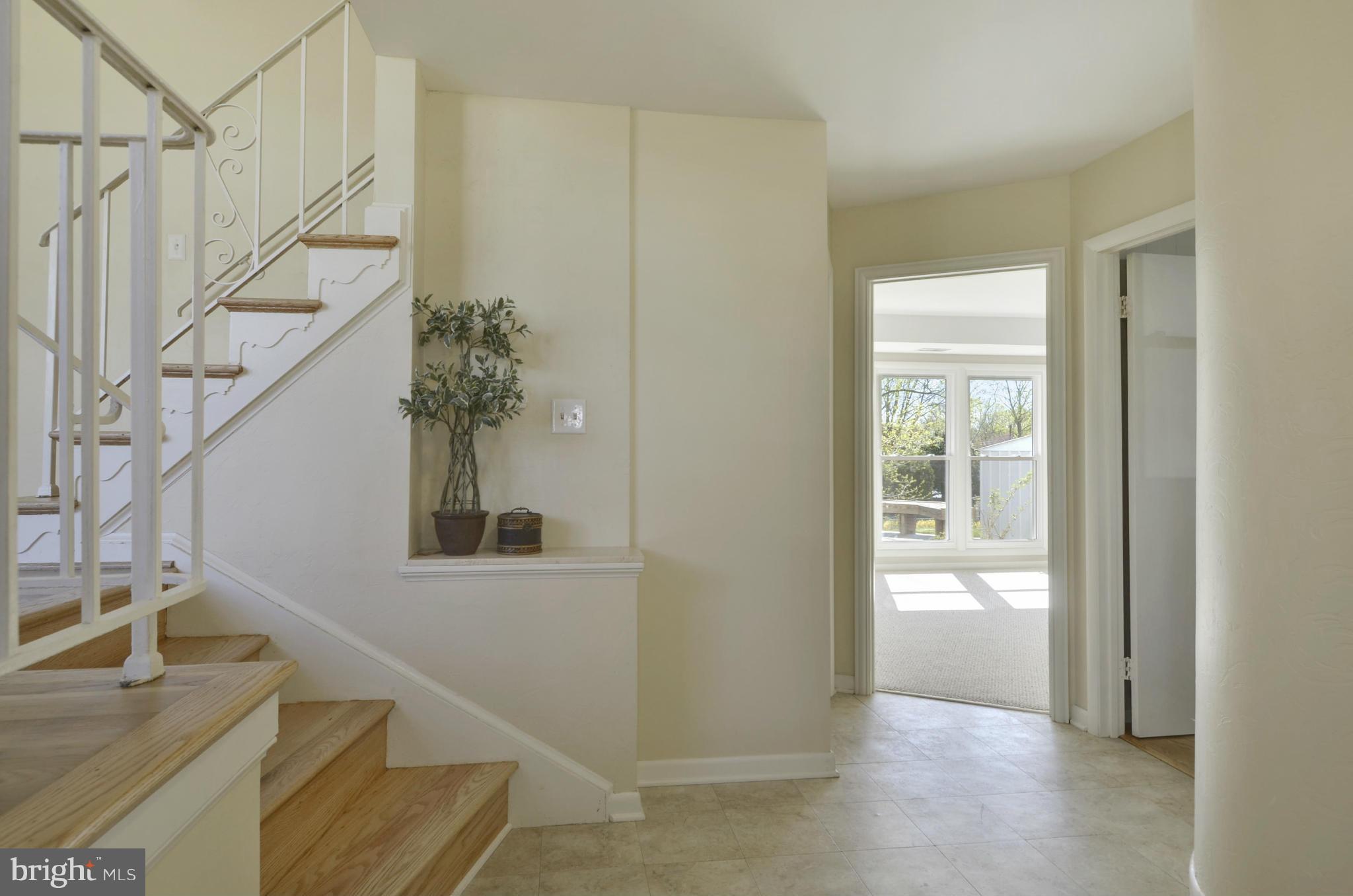 5404 Manorfield Road Rockville, MD 20853 - Photo 3 of 30 Foyer view to Family and Powder Rooms