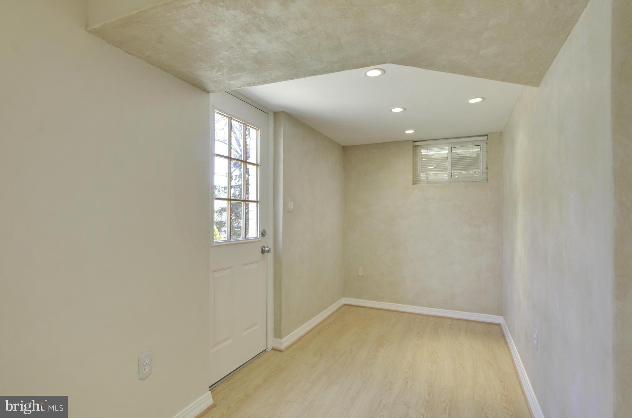 5404 Manorfield Road Rockville, MD 20853 - Photo 23 of 30 LL Foyer entrance from side yard/brick walkway