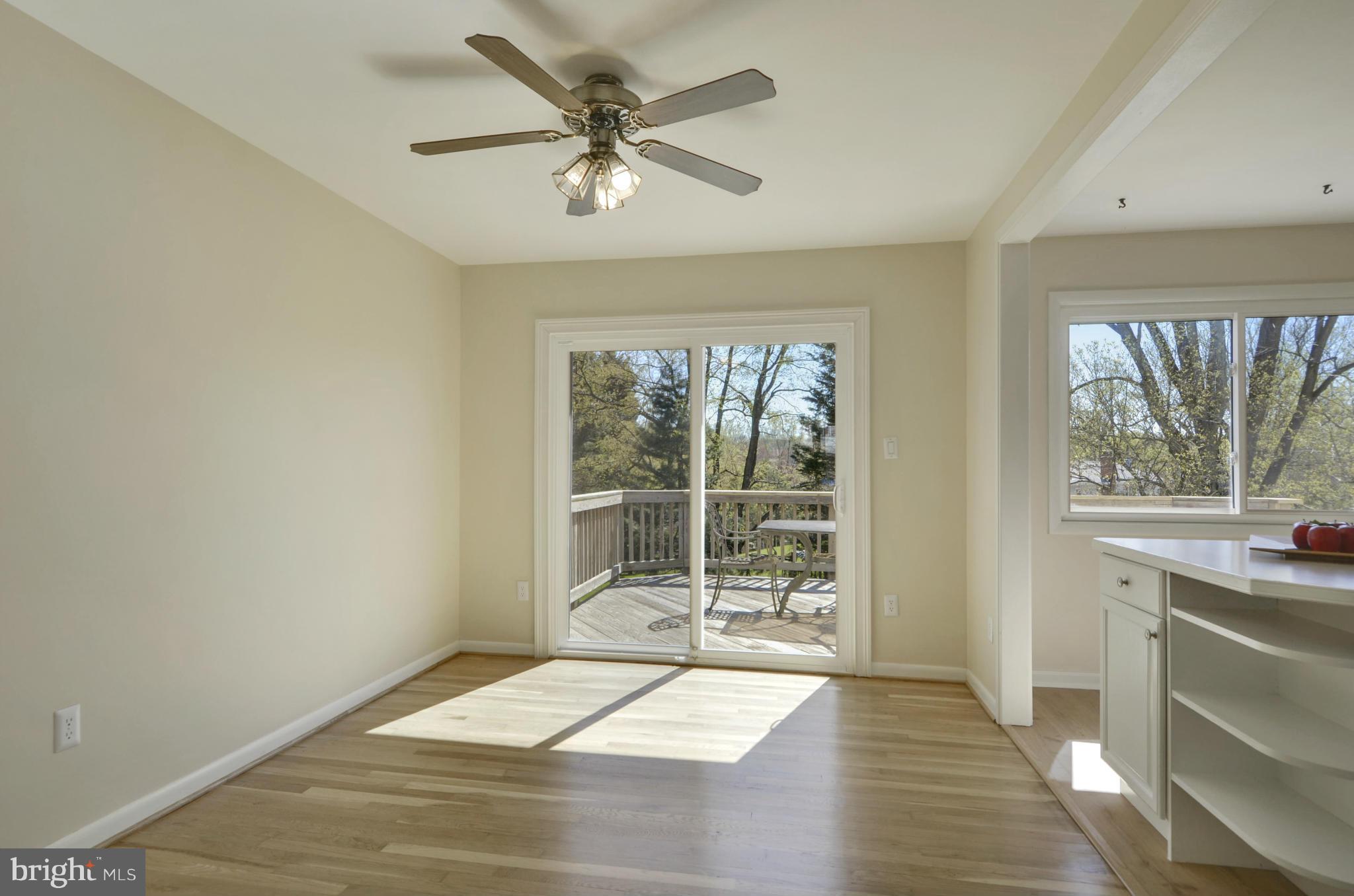 5404 Manorfield Road Rockville, MD 20853 - Photo 7 of 30 Dining Rm w/ceiling fan, new glass slider to Decks