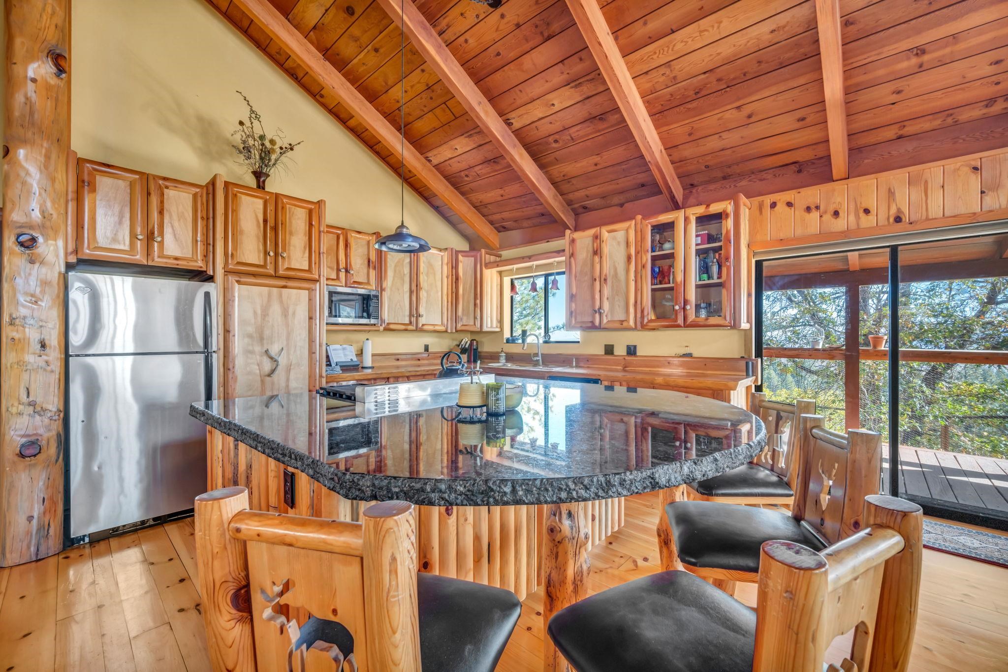 740-935 Sugar Loaf Road Doyle, CA 96109 - Photo 12 of 25 a living room with furniture a large window and wooden floor