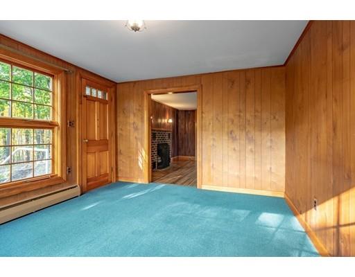 95 Lake Attitash Road Amesbury, MA 01913 - Photo 8 of 37 a view of an empty room with window