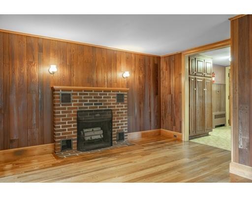 95 Lake Attitash Road Amesbury, MA 01913 - Photo 9 of 37 a view of an empty room and fire place