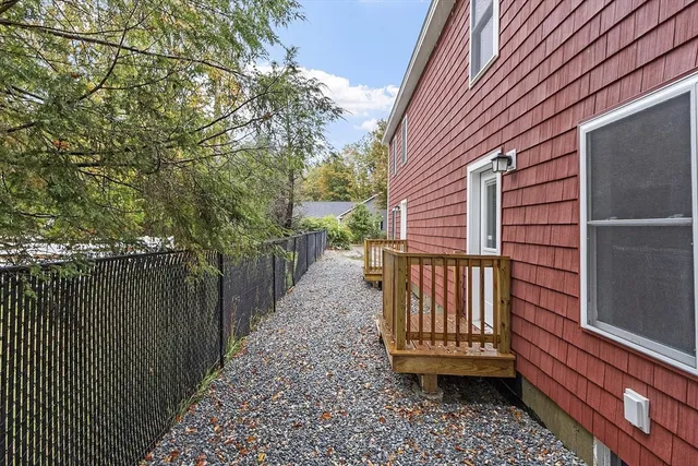 a view of a wooden deck front of house