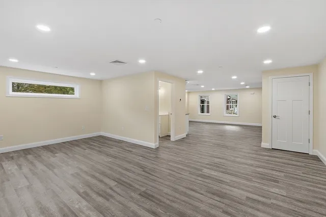 an empty room with wooden floor