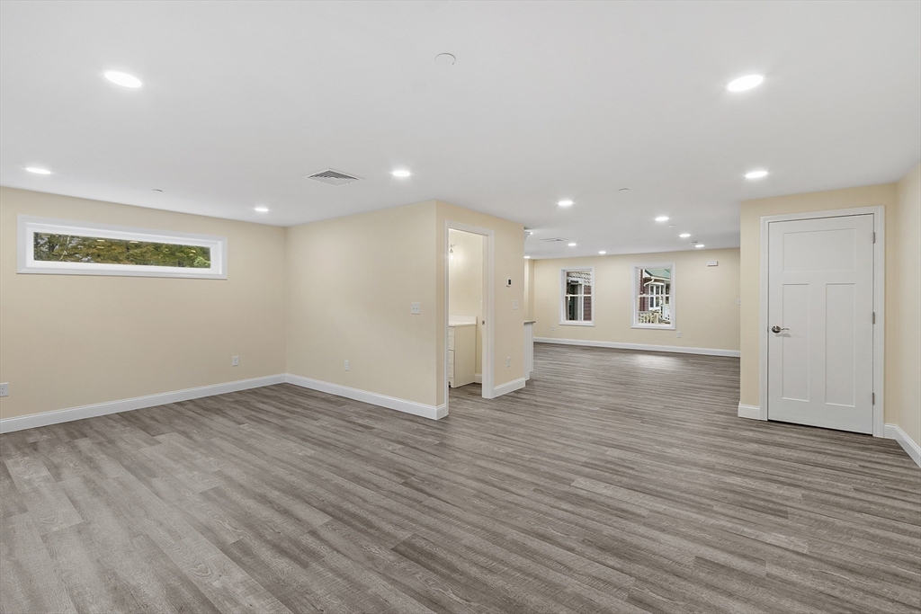 20 Townsend Street, Unit 1 Pepperell, MA 01463 - Photo 7 of 25 an empty room with wooden floor