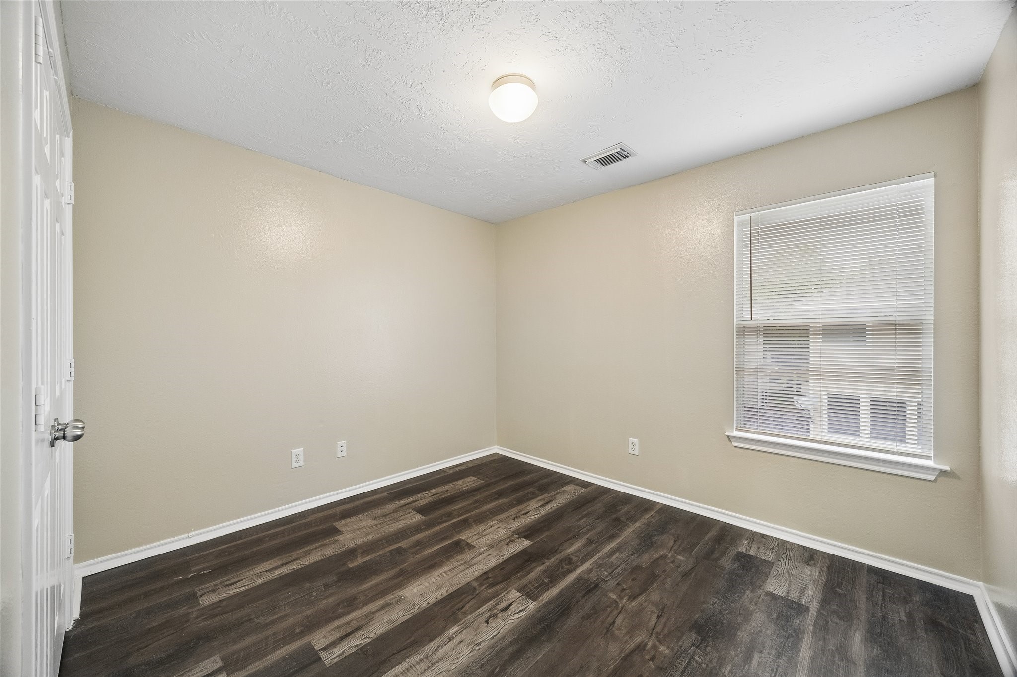 14334 Fairbuff Lane Houston, TX 77014 - Photo 11 of 15 a view of empty room with wooden floor