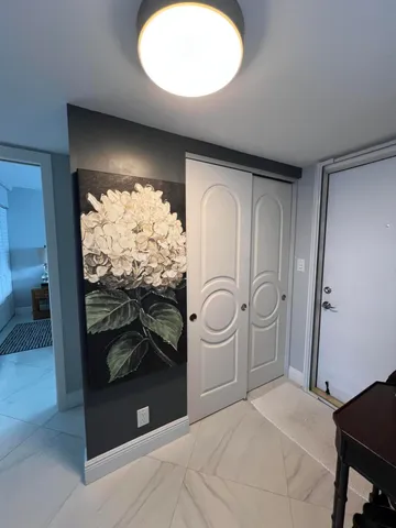 a kitchen with stainless steel appliances kitchen island granite countertop a stove sink and refrigerator