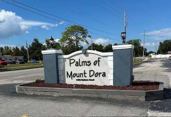 a sign on the side of a street