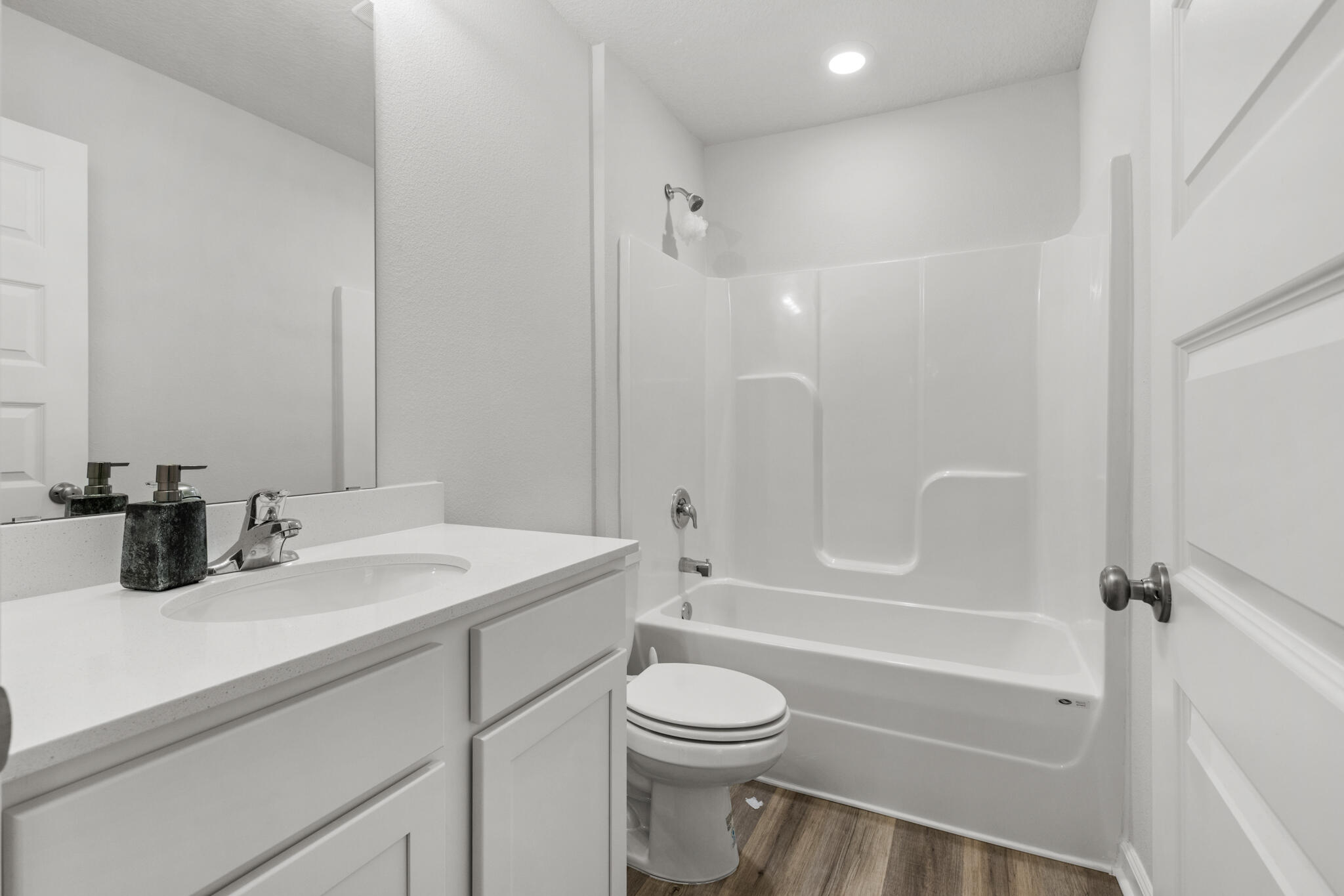 557 Mary Lou Way Crestview, FL 32539 - Photo 8 of 11 a bathroom with a granite countertop sink toilet and shower