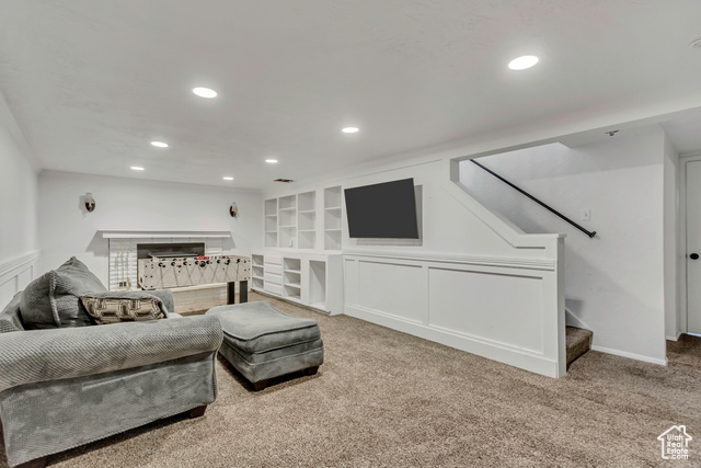 360 East Center Street Centerville, UT 84014 - Photo 36 of 41 Living room with carpet floors, recessed lighting, stairs, built in shelves, and ornamental molding