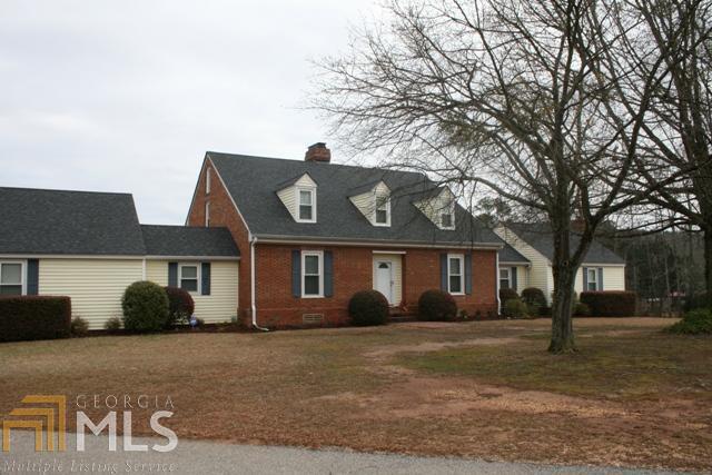 1010 Day Road Meansville, GA 30256 - Photo 1 of 1 a front view of a house with garden