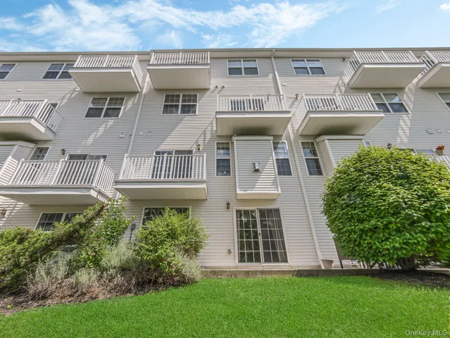 a view of a large building with a yard