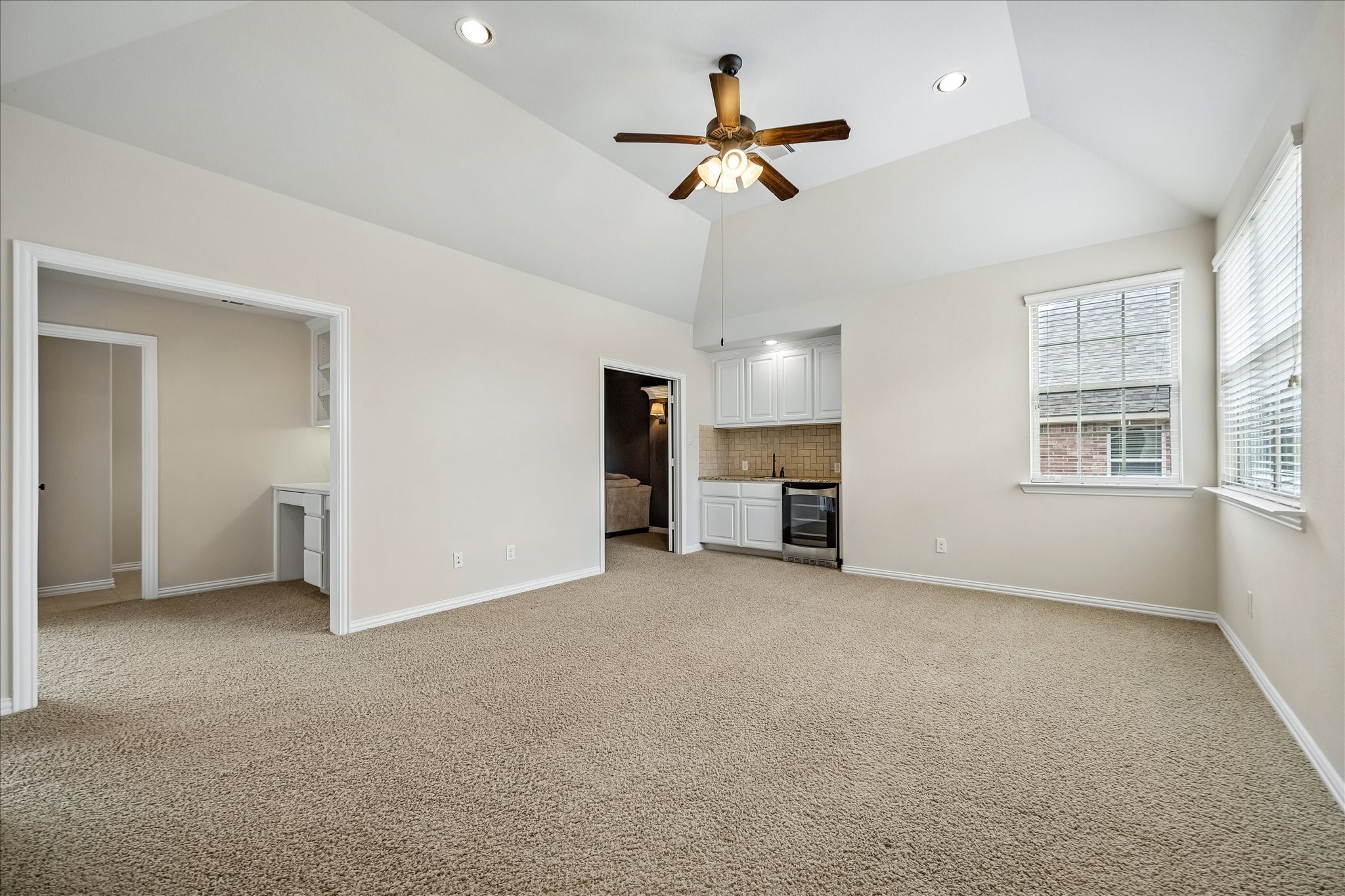 17403 Astrachan Road Richmond, TX 77407 - Photo 18 of 40 This spacious room includes a small kitchenette with a mini-fridge - ideal for a cozy living area or entertainment space.