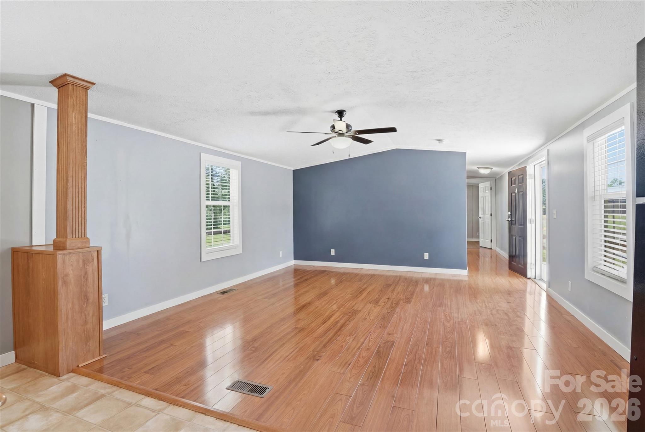 4406 Lucy Short Cut Road Marshville, NC 28103 - Photo 14 of 30 a view of an empty room with a window and wooden floor