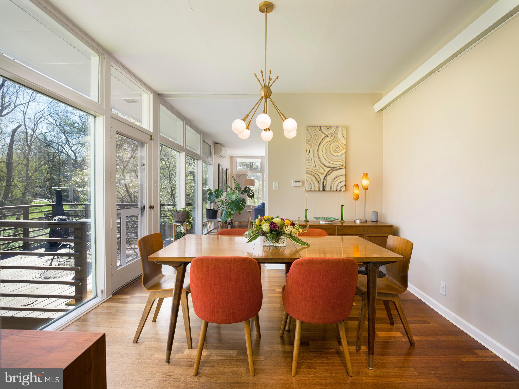 1321 Pepper Road Rydal, PA 19046 - Photo 17 of 49 a dining room with furniture a chandelier and wooden floor