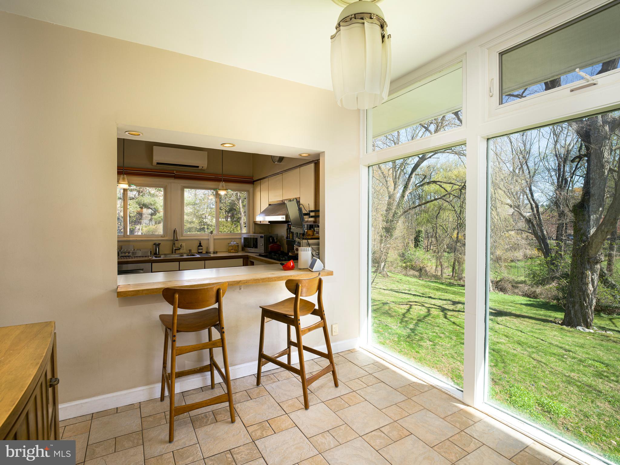 1321 Pepper Road Rydal, PA 19046 - Photo 20 of 49 a dining room with furniture and large windows