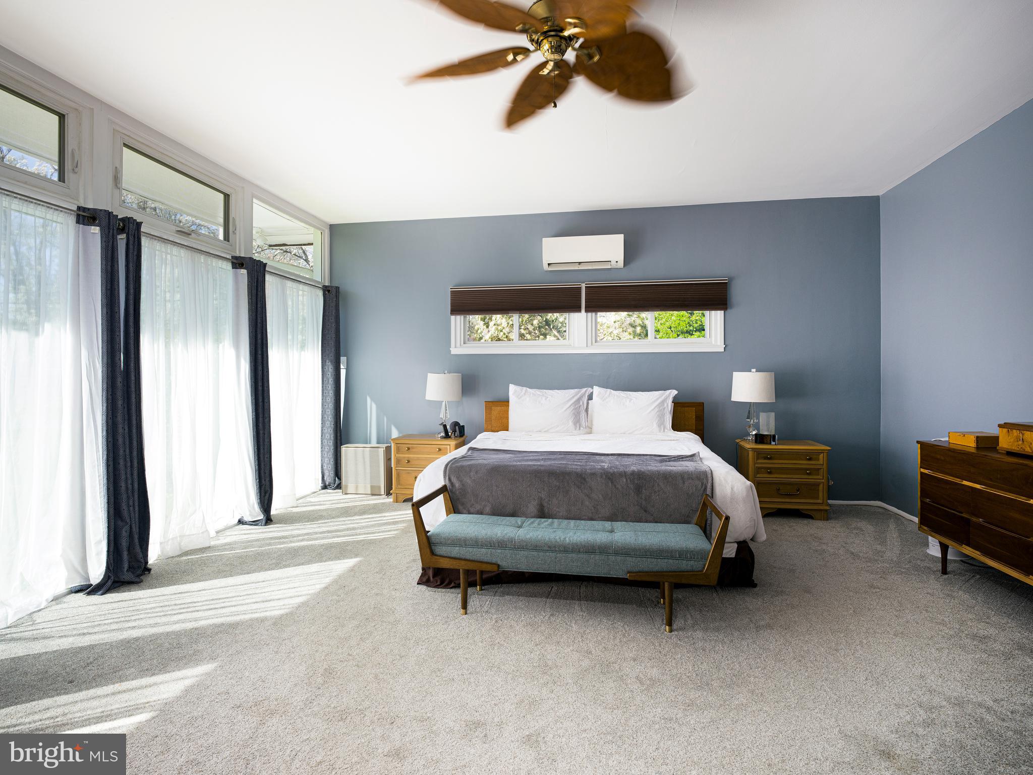 1321 Pepper Road Rydal, PA 19046 - Photo 28 of 49 a bedroom with a bed and a chandelier