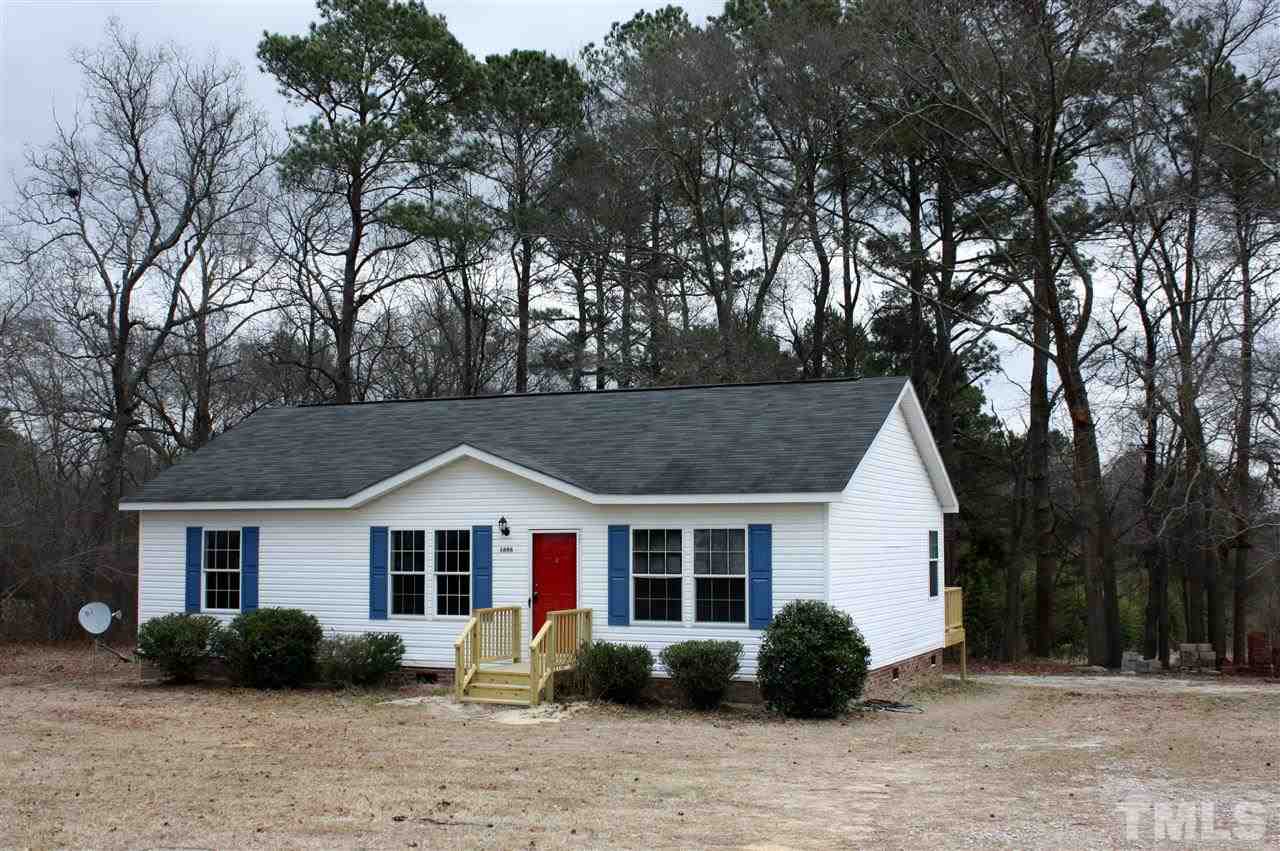 1696 Oak Grove Church Road Angier, NC 27501 - Photo 1 of 16 Large and flat front yard welcomes you home.